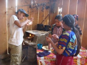 tourist & girls making tortillas (av)