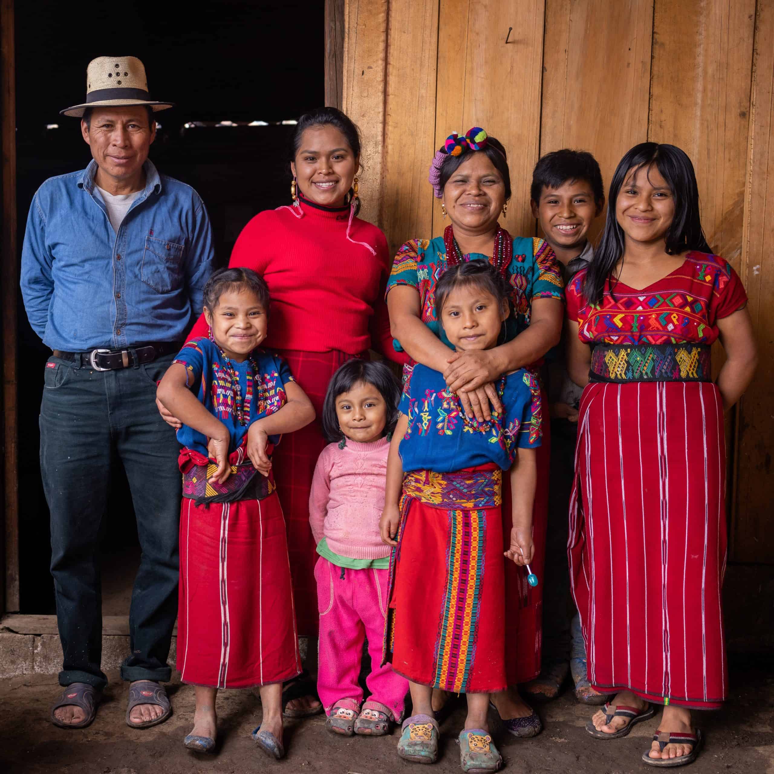 Group of Ixil community members in traditional clothing at Colegio Horizontes.