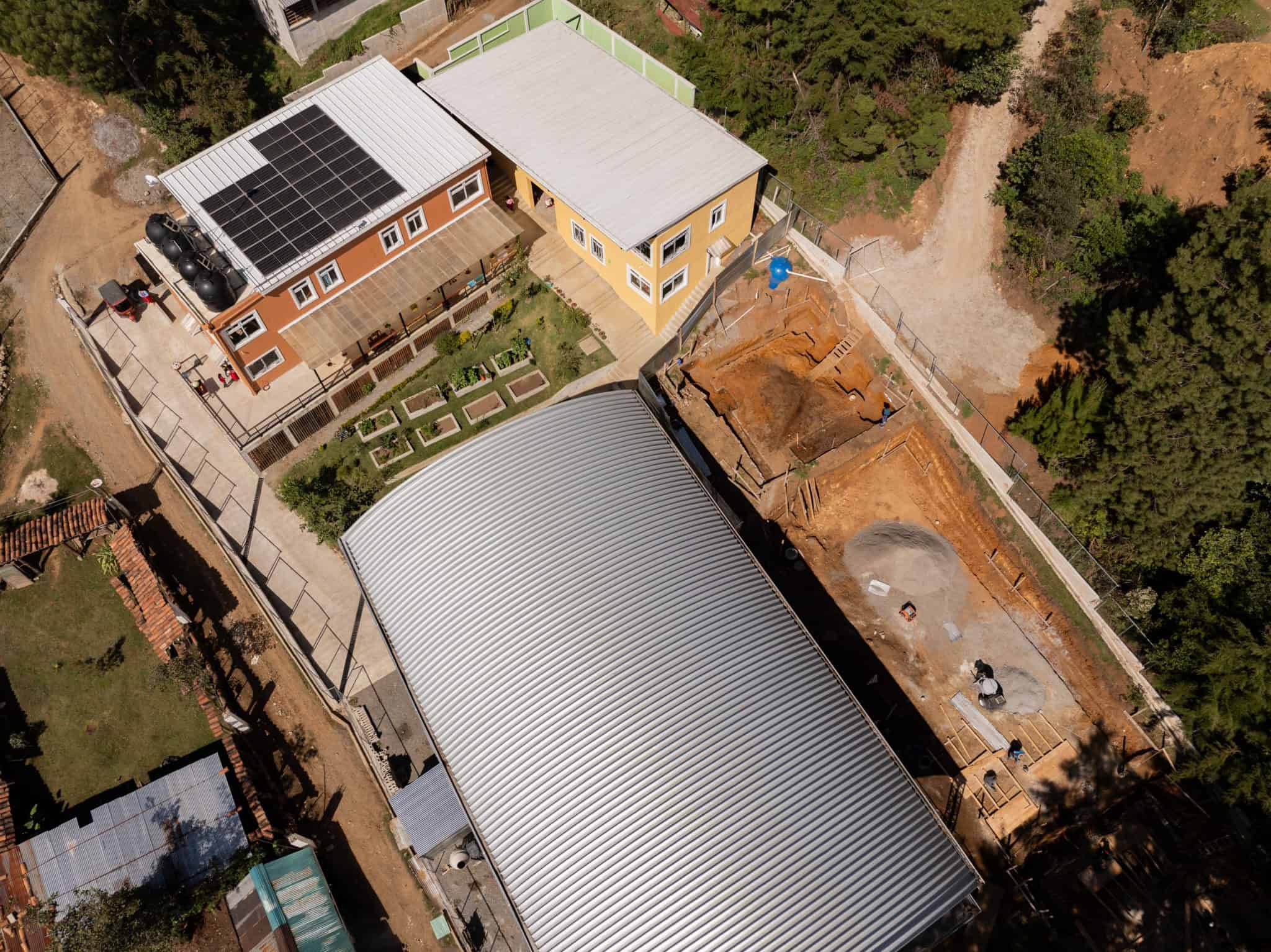 Aerial view of Limitless Horizons Ixil school buildings and playground in Guatemala.