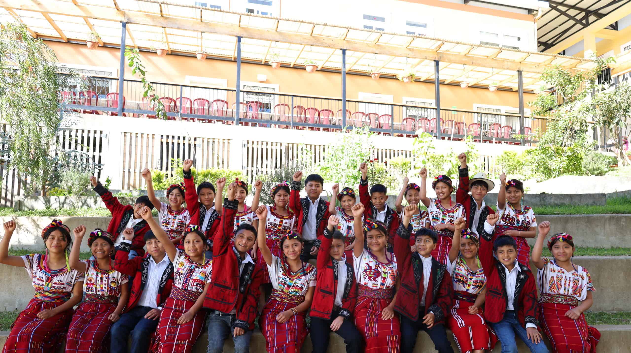 Colorful Ixil children in traditional attire at Colegio Horizontes, part of Limitless Horizons Ixil.